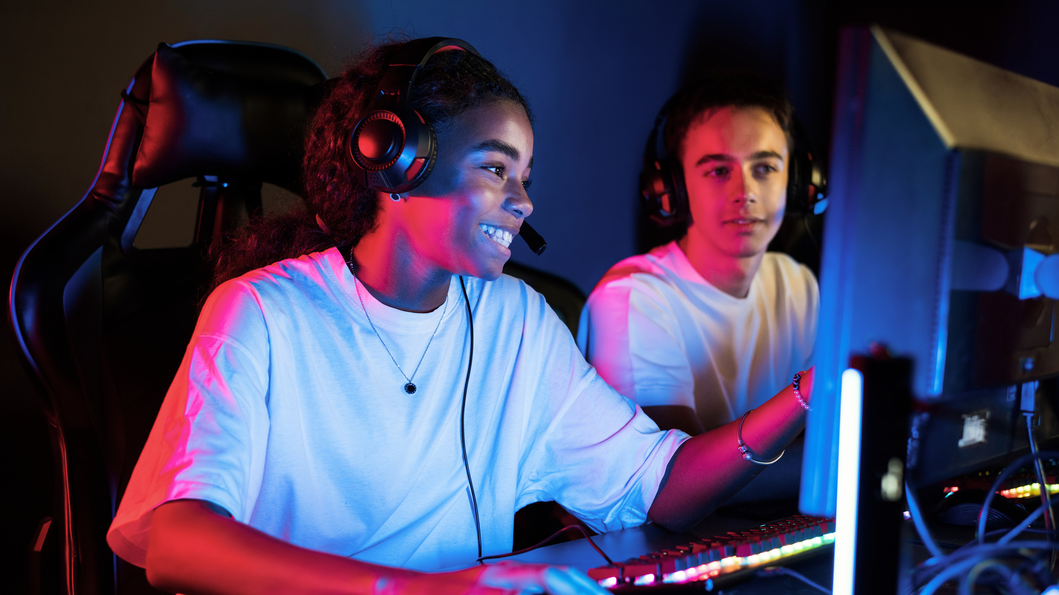 Teens playing in video game club