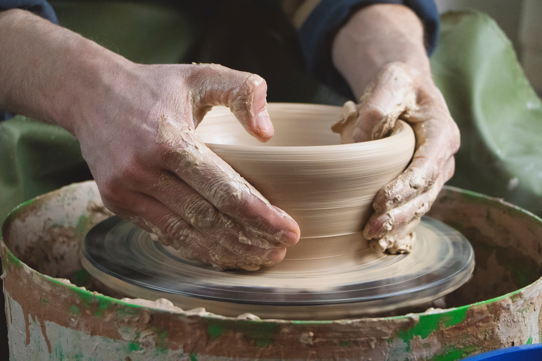 Close Up of Potter Working on Workshop
